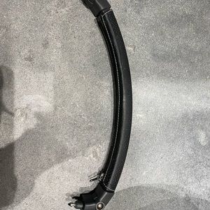 Uppababy bumper bar with black leather covering.